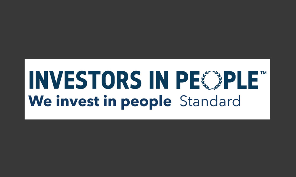 The Investors In People accreditation logo, which reads 'Investors In People. We Invest In People. Standard.'
